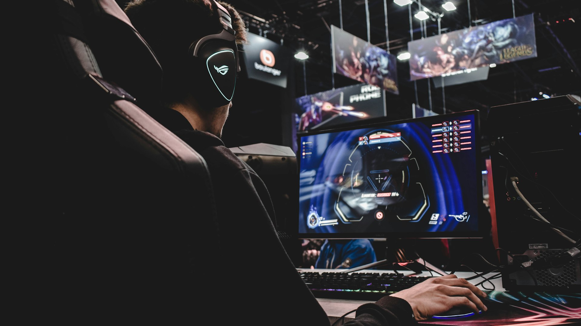 Gaming battlestation lit in violet inside a Surry Hills warehouse